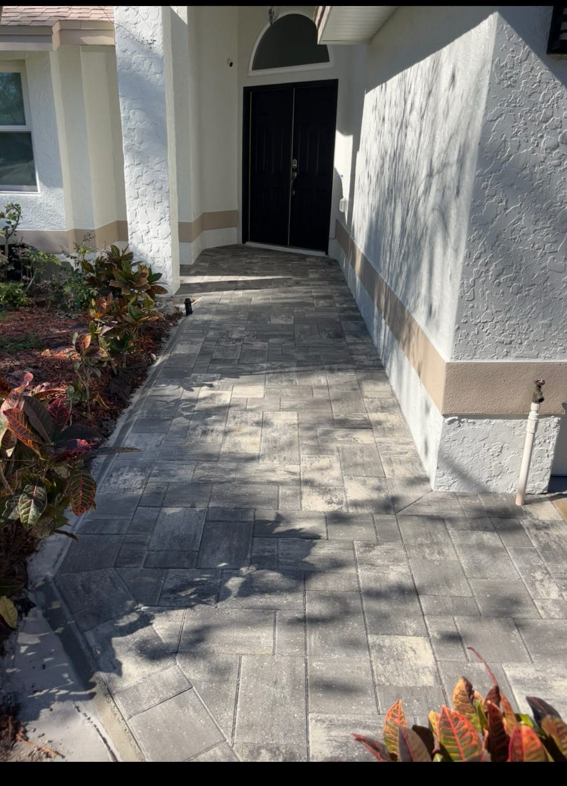 Gray paver front entry walkway in North Florida